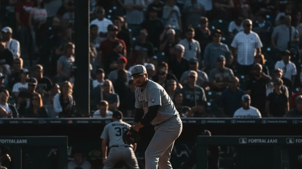 A baseball reliever warming up in the bullpen, symbolizing Craig Stammen’s focus and quiet preparation before entering the game.